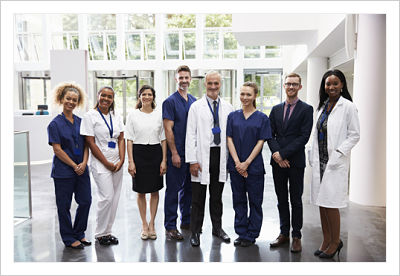 This is a picture of nurses and doctors standing in a lobby